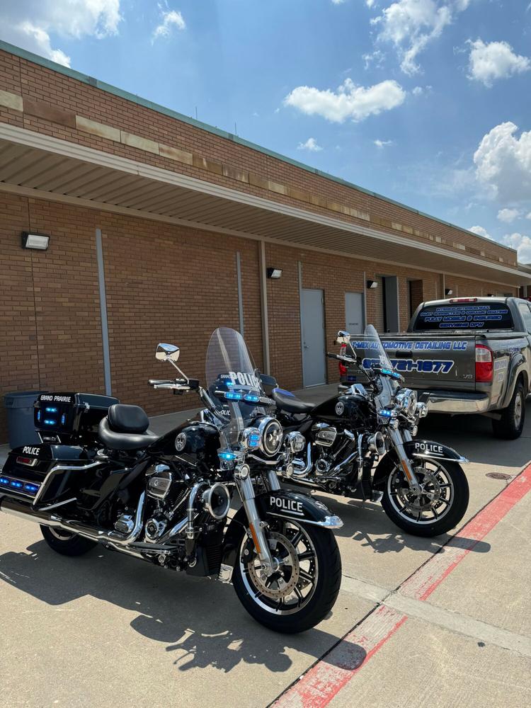 Fleet motorcycles and T-Mex work truck